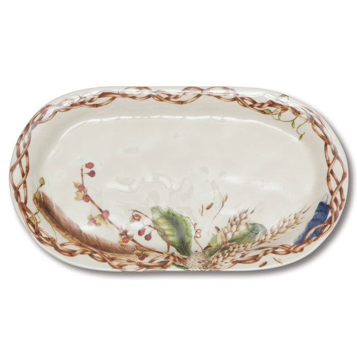 13.5-inch oval ceramic hostess platter featuring a rustic nature motif of wheat, berries, and feathers on a cream background.