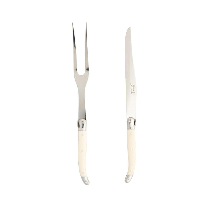 Laguiole carving set with stainless steel blades and ivory-colored riveted ABS handles against a white background.