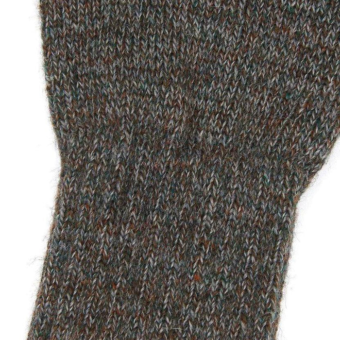 Close-up of brown and grey marled lambswool fingerless gloves with a textured 7-gauge knit.