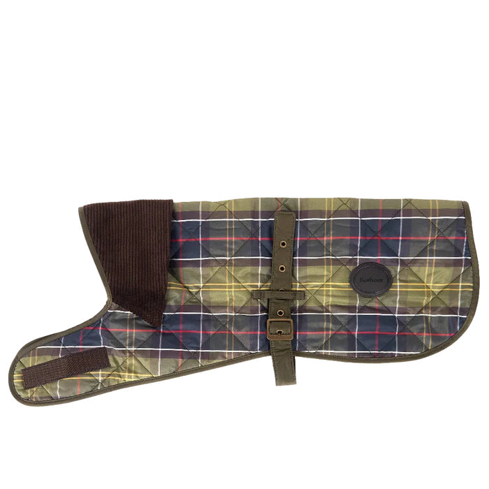 Barbour quilted tartan dog coat in olive green with a brown corduroy collar, adjustable strap, and leather logo badge.
