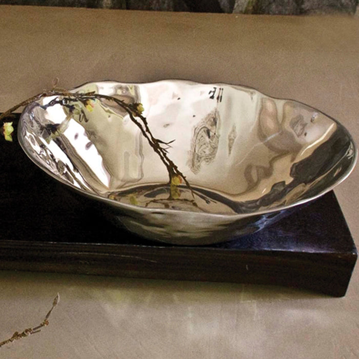 Beatriz Ball Soho medium round bowl in polished, sand-cast aluminum with an organic, wavy rim design.