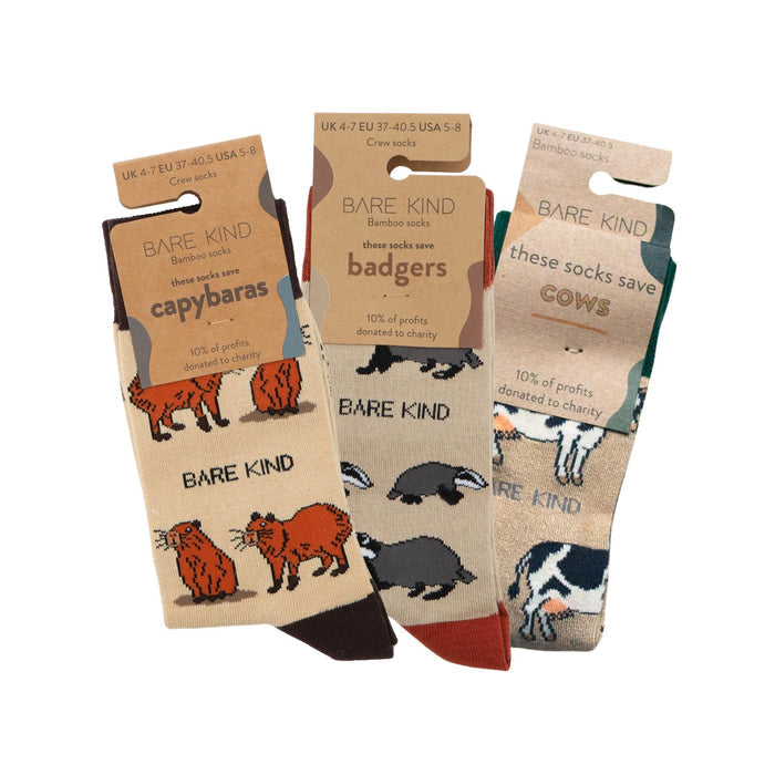 flat lays of Capybara, Badger, Cow bamboo socks