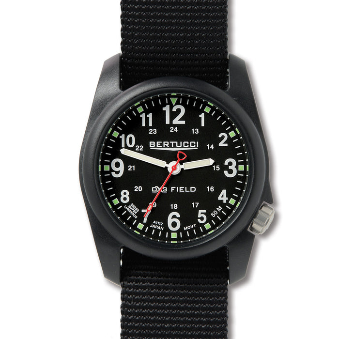 Bertucci DX3 field watch with a black poly-resin case, black dial, luminous markers, and a durable black nylon strap.