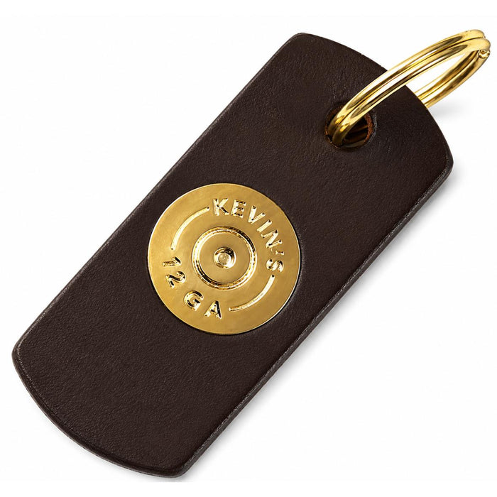 Dark brown English bridle leather keyring featuring a polished brass 12-gauge shotshell accent and gold ring.