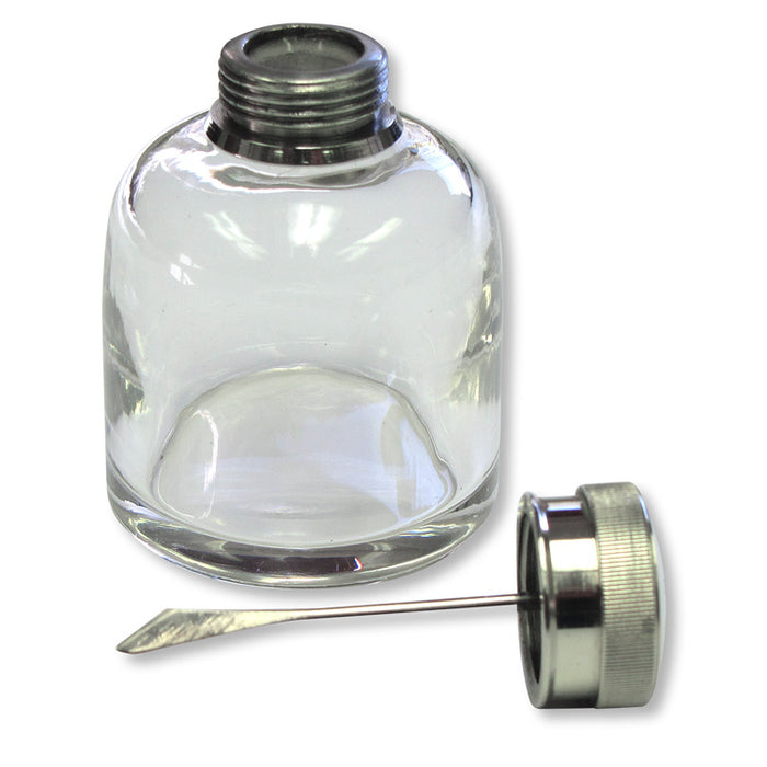 Round glass oil bottle with a nickel-plated brass lid and a traditional flattened blade applicator for gun maintenance.