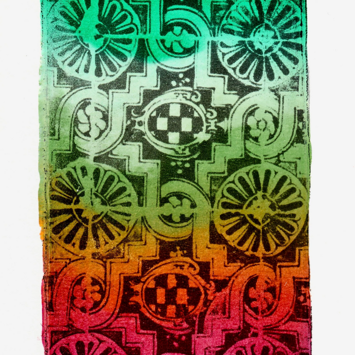 An example of a gelli art image transfer print- a black geometric design against a rainbow background.