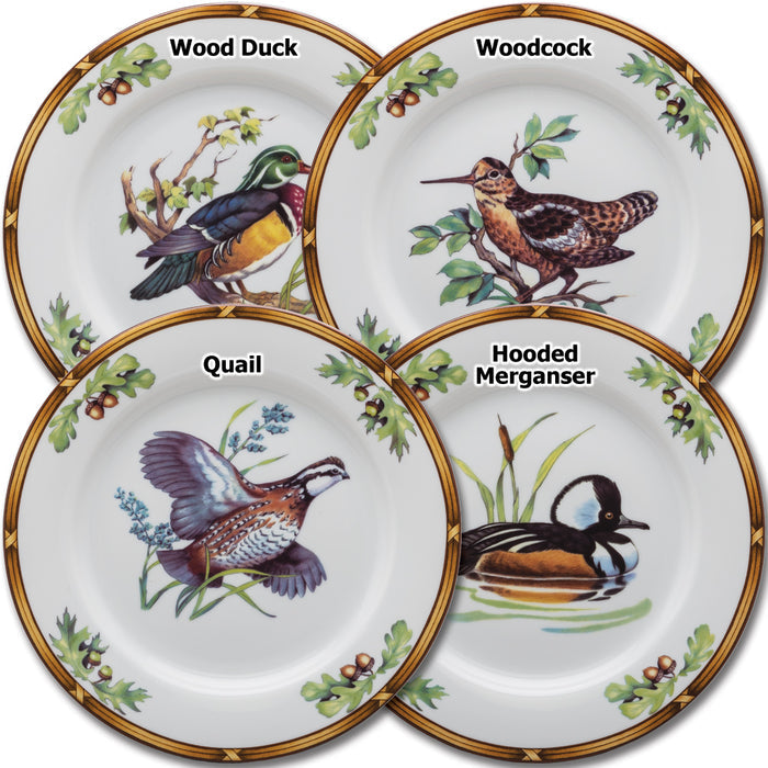 Set of four 8-inch porcelain salad plates featuring detailed wildlife designs of a Wood Duck, Woodcock, Quail, and Hooded Merganser.