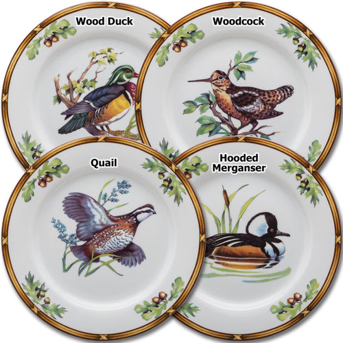 Set of four 8-inch porcelain salad plates featuring detailed wildlife designs of a Wood Duck, Woodcock, Quail, and Hooded Merganser.