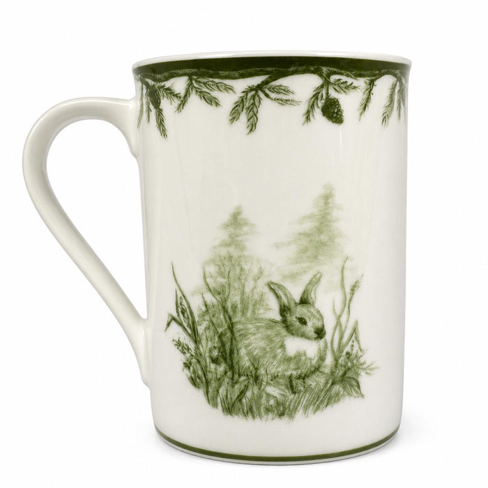 White porcelain mug featuring a green forest scene with a rabbit and pine branch trim, dishwasher safe.