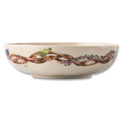 Juliska Forest Walk 8.5-inch ceramic coupe bowl featuring a woodland vine, berry, and leaf pattern on an off-white base.