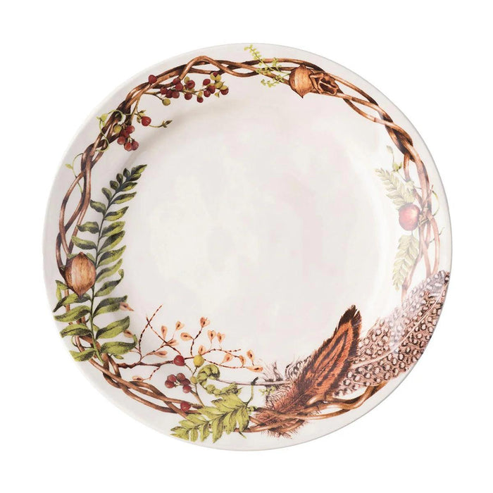 Juliska Forest Walk 11-inch stoneware dinner plate featuring a decorative woodland wreath of ferns, berries, and feathers.