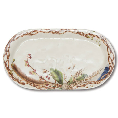 13.5-inch oval ceramic hostess platter featuring a rustic nature motif of wheat, berries, and feathers on a cream background.