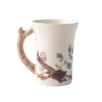 Juliska Forest Walk 12oz ceramic mug with a branch-shaped handle and detailed woodland botanical illustrations.