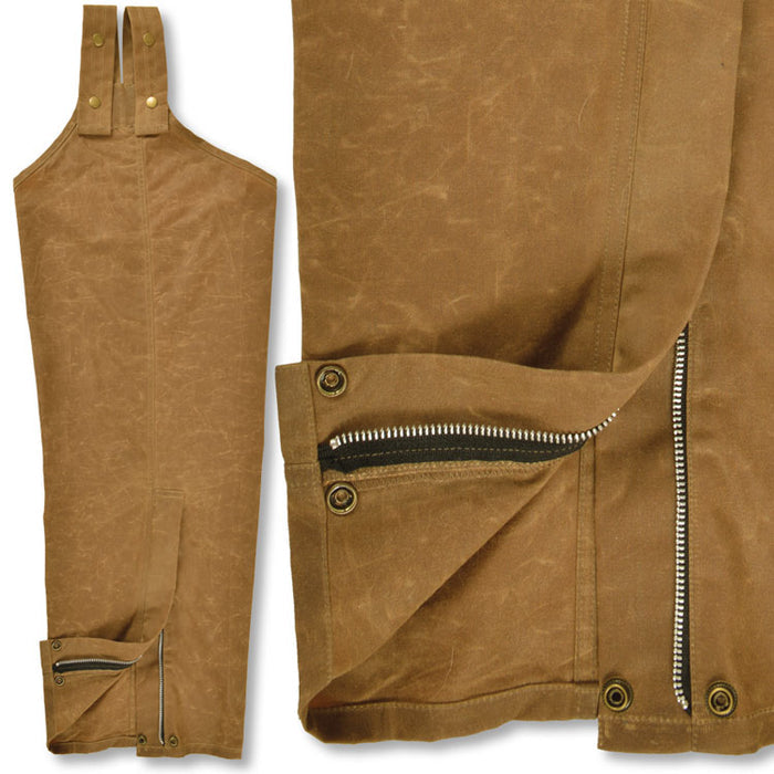 Brown waxed cotton hunting chaps featuring brass zippers, reinforced snap straps, and durable weather-resistant fabric.