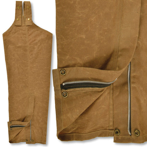 Brown waxed cotton hunting chaps featuring brass zippers, reinforced snap straps, and durable weather-resistant fabric.