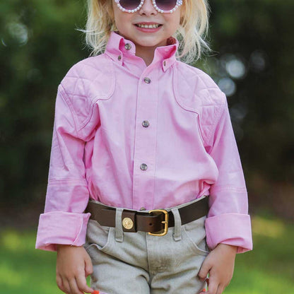 Child wearing a pink 100% cotton long-sleeve shooting shirt with quilted shoulder patches and a button-down collar.