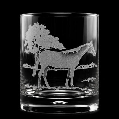 11oz crystal old fashioned glass featuring a detailed sand-etched horse standing under a tree against a black background.