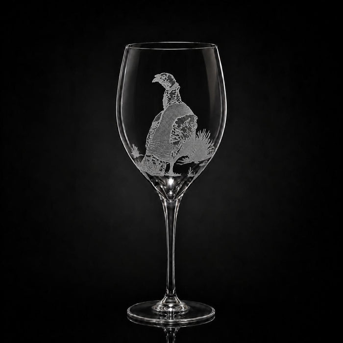 11 oz crystal white wine glass with a hand-etched pheasant design on a black background.