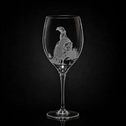 11 oz crystal white wine glass with a hand-etched pheasant design on a black background.