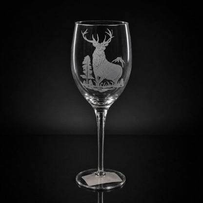 11 oz white wine glass featuring a hand-etched, multi-layered elk design on clear crystal against a black background.
