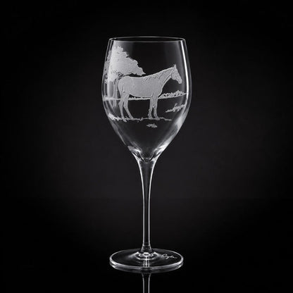 11 oz crystal white wine glass featuring a hand-etched horse design on a clear glass against a black background.