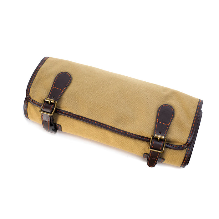 Tan canvas roll-up cleaning kit with mahogany leather trim and brass buckle closures on a white background.