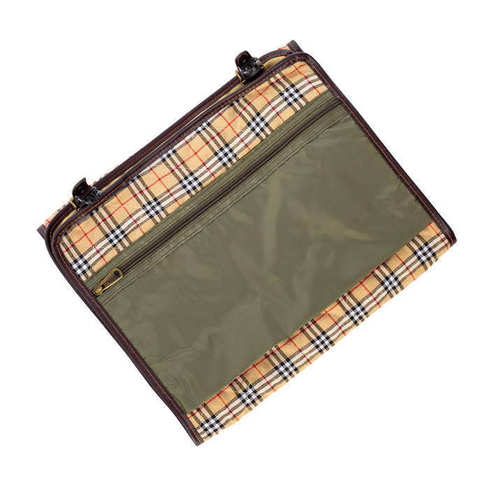 Roll-up cleaning kit in tan tattersall canvas with mahogany leather trim, green nylon pocket, and brass hardware.