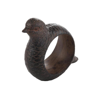 Hand-carved dark brown resin napkin ring featuring an intricate, lifelike pheasant design for rustic table decor.