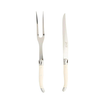 Laguiole carving set with stainless steel blades and ivory-colored riveted ABS handles against a white background.