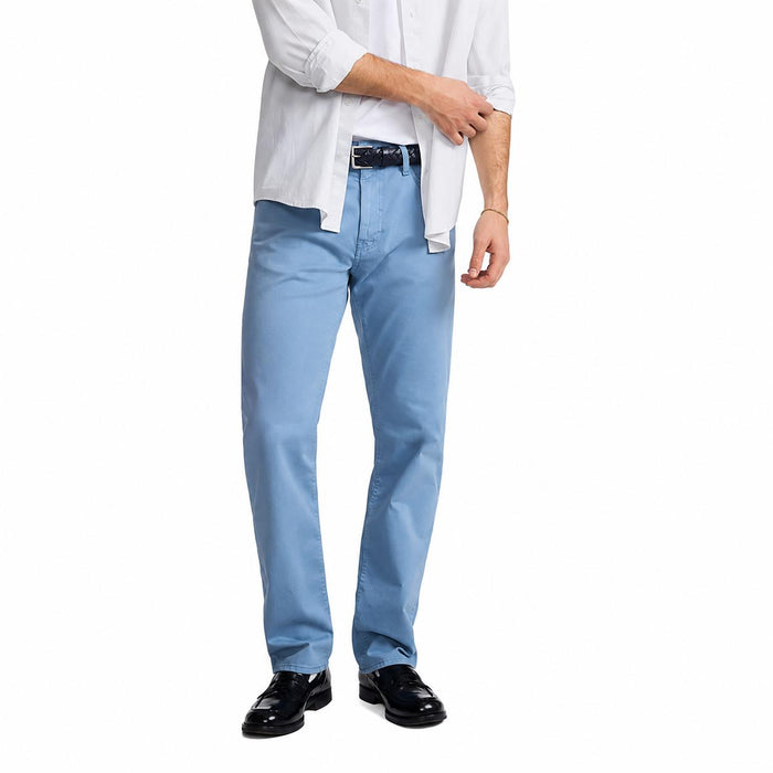Mavi Men's Zach straight leg stretch twill jeans in light blue, worn with a white shirt and black loafers.