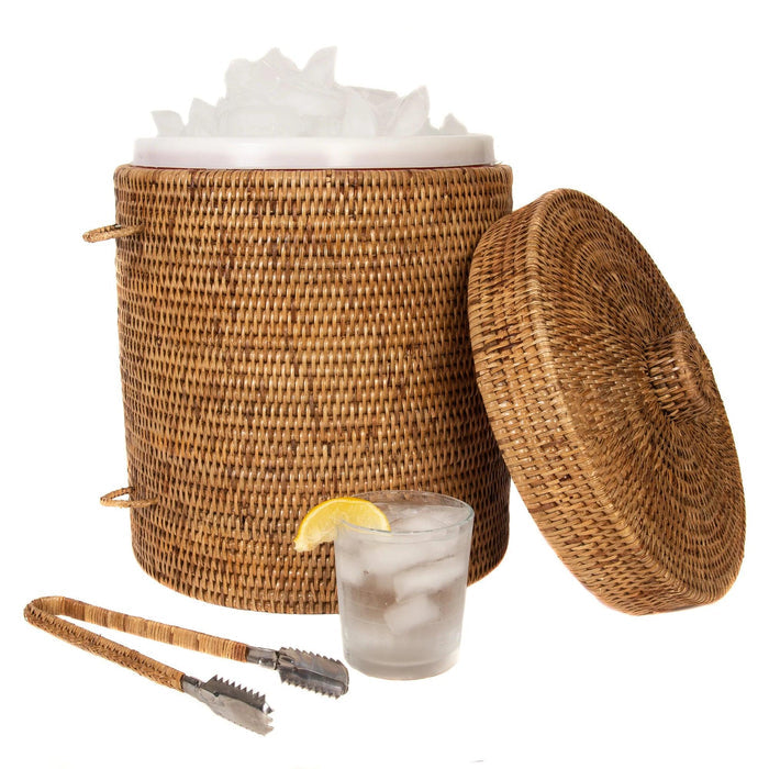 Handwoven Burmese rattan ice bucket with matching tongs, lid, and a glass of iced lemon water on a white background.