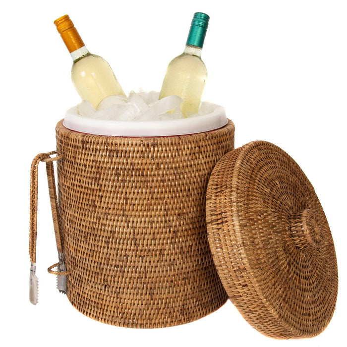 Handwoven Burmese rattan ice bucket with matching tongs, filled with ice and two wine bottles, isolated on white.
