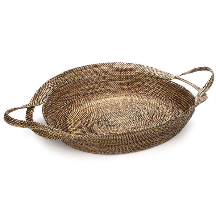 Handwoven oval wicker basket made from natural vine with sturdy side handles and a smooth, clear lacquer finish.