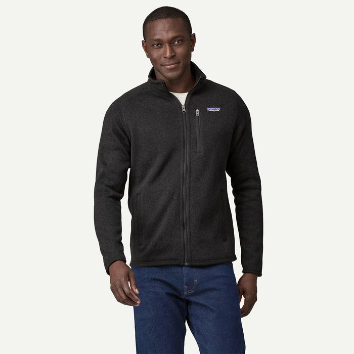 Man wearing a charcoal grey Patagonia Better Sweater fleece jacket with a full-zip front and stand-up collar.