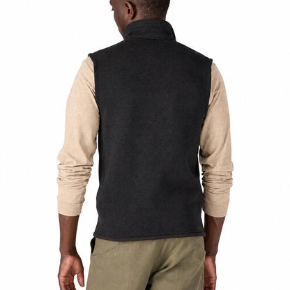 Back view of a man wearing a charcoal grey Patagonia Better Sweater fleece vest with a stand-up collar.