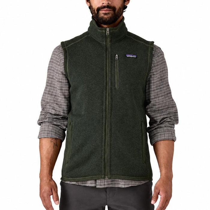 Man wearing a dark green Patagonia Better Sweater fleece vest with a full-zip front and chest pocket.