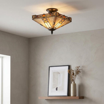 Geometric Prairie-style Tiffany semi-flush ceiling light with amber stained glass illuminating a neutral modern room.