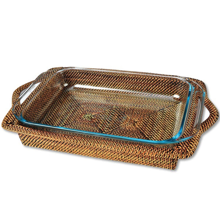 Rectangular 3-quart Pyrex casserole dish set in a handwoven, artisanal brown watervine wicker holder.
