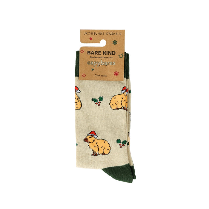 Beige socks with capybara pattern and 'Bare Kind' packaging on a white background