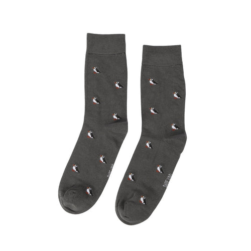 Dark gray socks with small puffin pattern on a white background