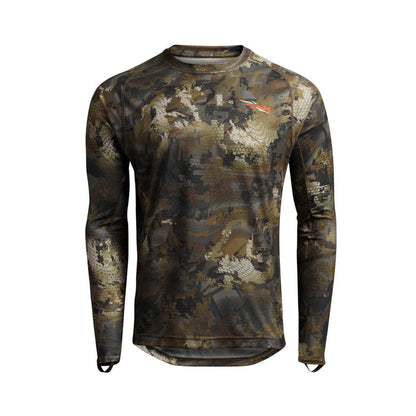 Sitka Core Lightweight long sleeve crew shirt in camo print with moisture-wicking fabric and orange logo detail.