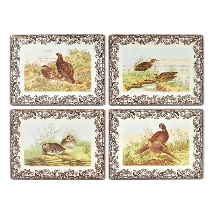 Set of four rectangular Spode Woodland placemats featuring gamebird illustrations with brown floral borders and cork backing.