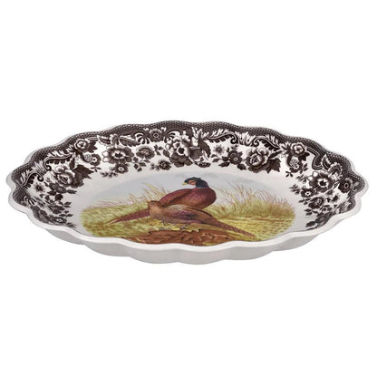 Spode Woodland 14.5-inch oval fluted earthenware dish featuring a pheasant illustration and brown floral border.
