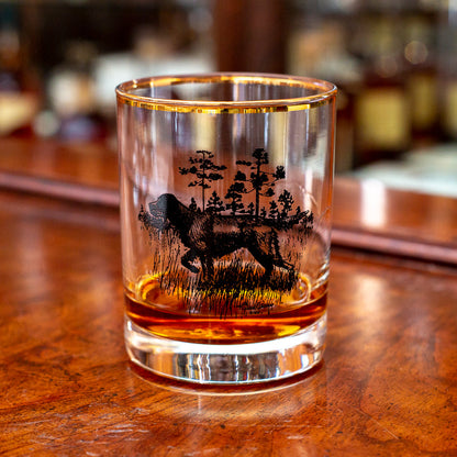 14 oz double old fashioned glass with a gold rim and black Richard E. Bishop sporting dog illustration.