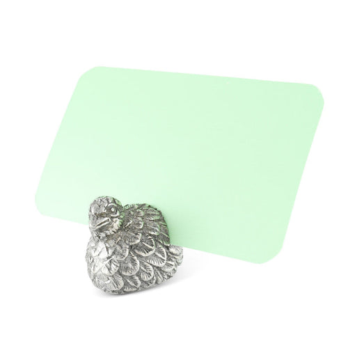 Detailed pewter quail place card holder with a textured feather design holding a blank light green card.