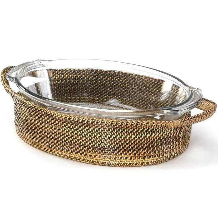 4-quart oval glass casserole dish inside a handwoven, natural watervine wicker basket with side handles.