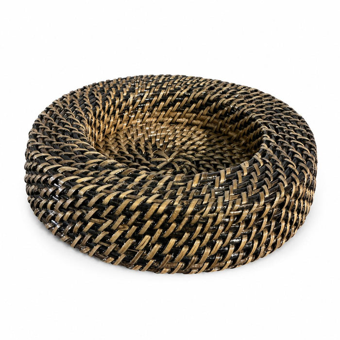 Handwoven round wine coaster made from sustainable dark and natural water vines with a detailed, durable wicker texture.