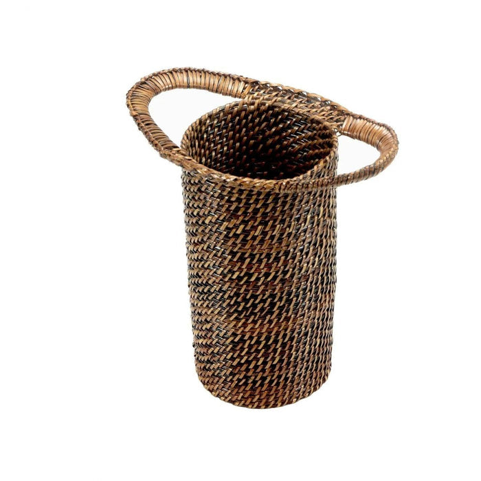 Handwoven dark brown water vine wine bottle holder with a cylindrical shape and integrated side handles.