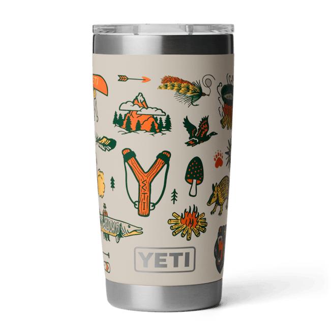 YETI 20 oz Rambler tumbler in tan with colorful outdoor-themed illustrations and a clear MagSlider lid.