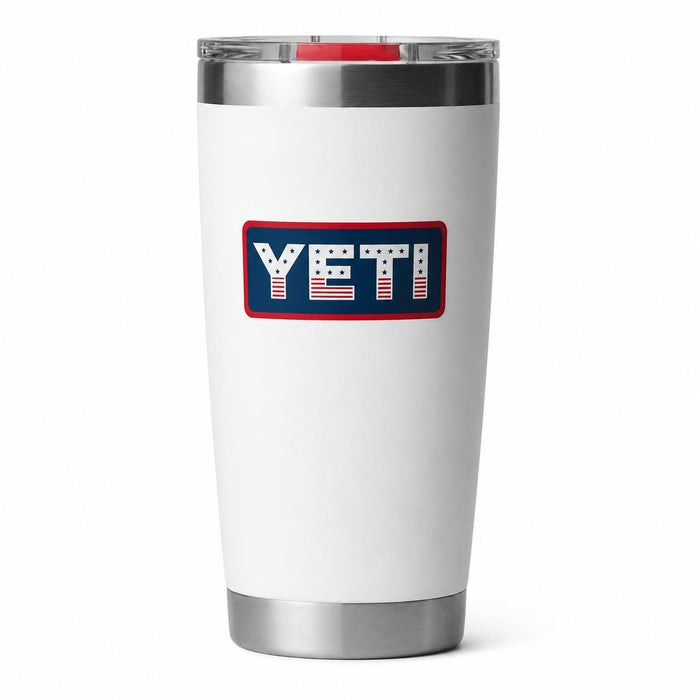 White 20 oz YETI Rambler tumbler with a stainless steel base and a MagSlider lid featuring a patriotic American flag logo.